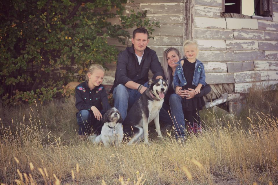 The Huxted family, owners of Hat Furnace & Duct Cleaning, with their two dogs