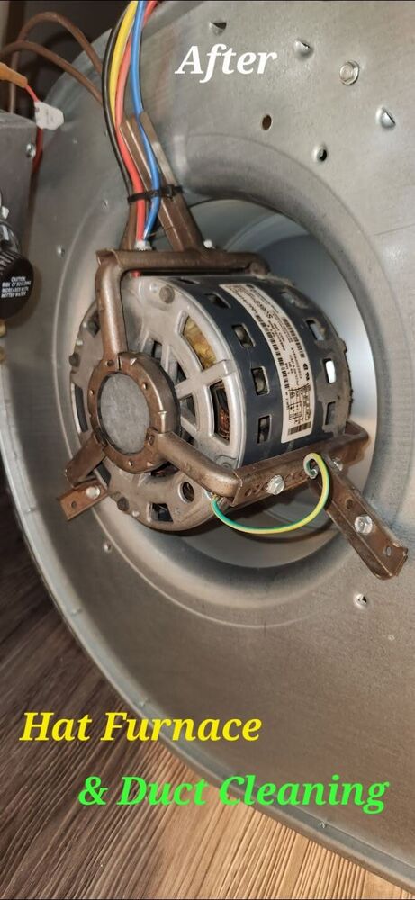 The same blower motor after cleaning, label and mounting brackets clearly visible