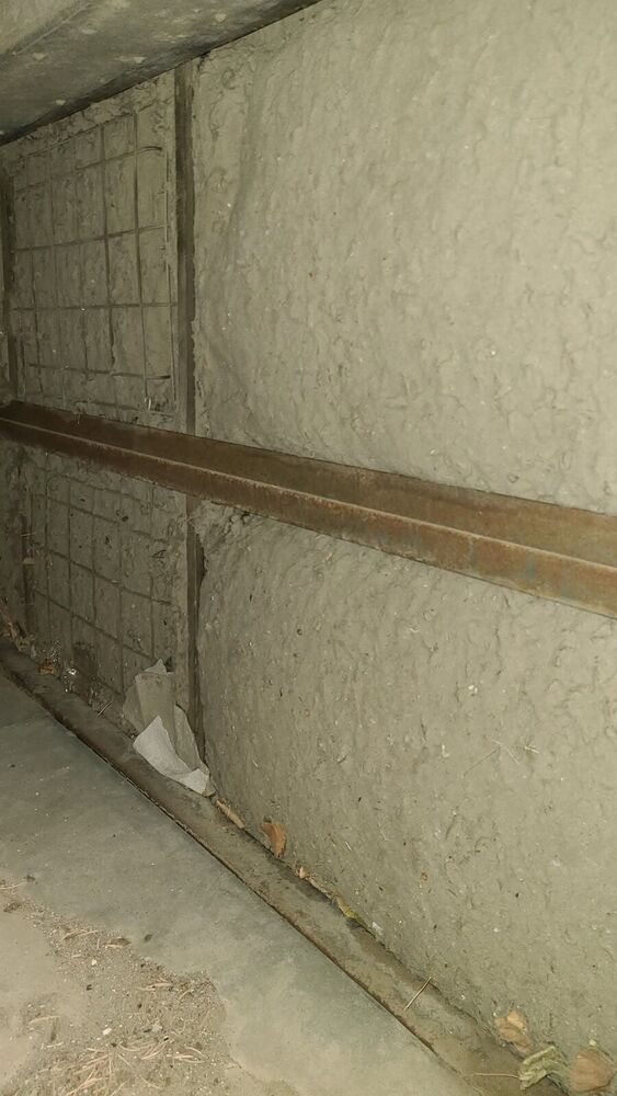 Finned coil bank in an air handler buried under a felt-thick layer of dust