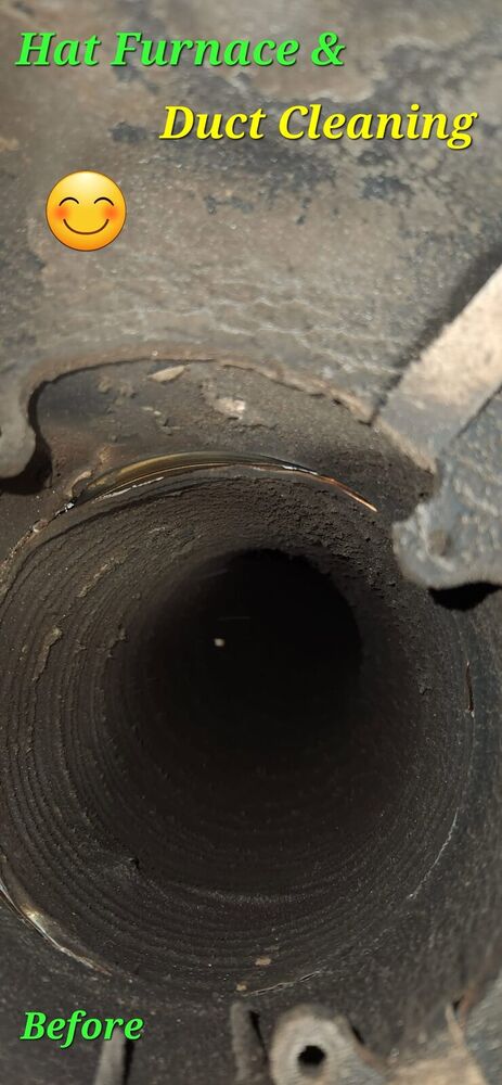 Round flue opening blackened with soot before cleaning