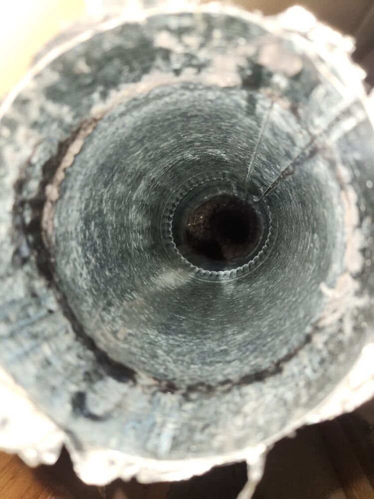 Looking straight down the same duct, clean and clear after cleaning